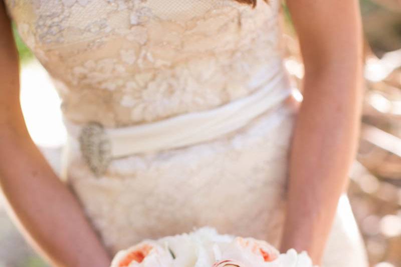 Romantic bridal bouquet with peach garden roses, succulents ranunculus and peony