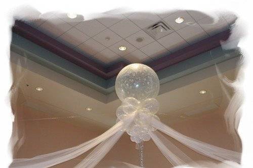 Instead of balloon arches utilize a enchanted  drape of linen. .