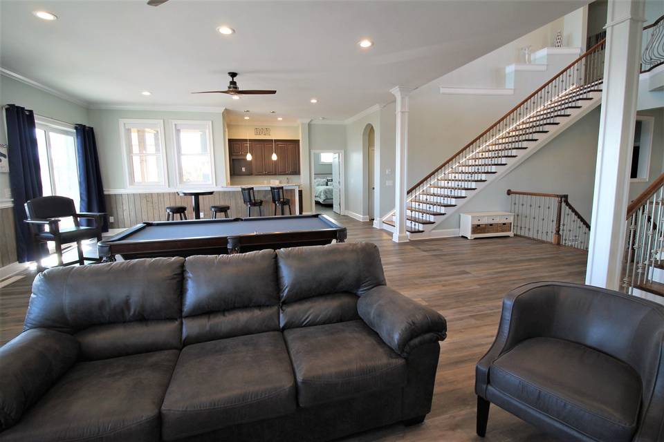 Living area with pool table and bar