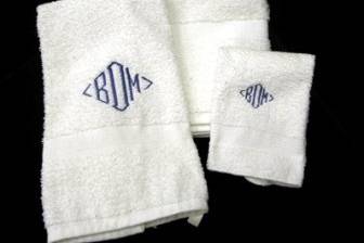 An embroidered set of towels is a great wedding  gift. Personalize a gift they would not normally buy for themselves. Style shown is #1 Diamond initials. Typical ettiquette - wife's first initial is on left.....last initial in the middle....husband's first name initial is on right.......We only offer white towels at this time. Various thread colors are available... If you are in Cleveland, bring in your own towels & we will monogram them for you.