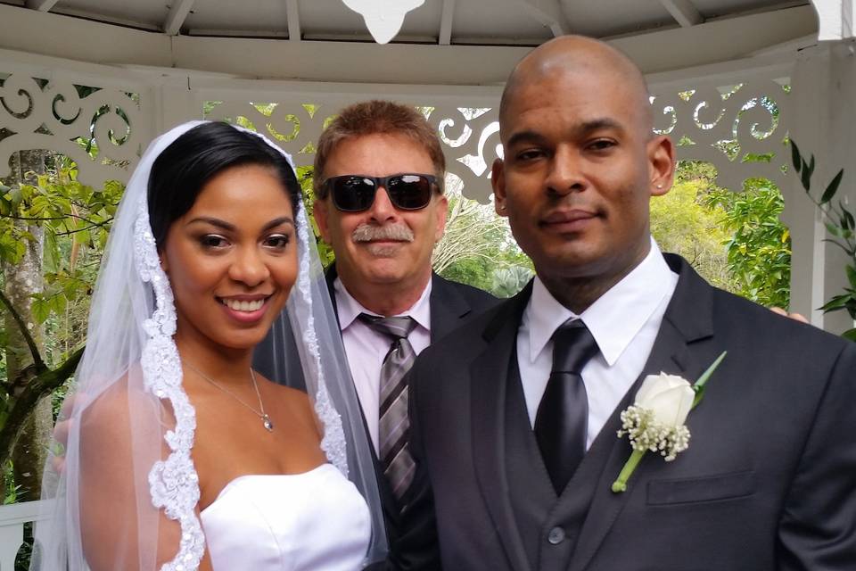 Bride and groom with their officiant