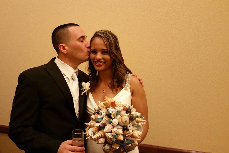 Groom kissing his bride