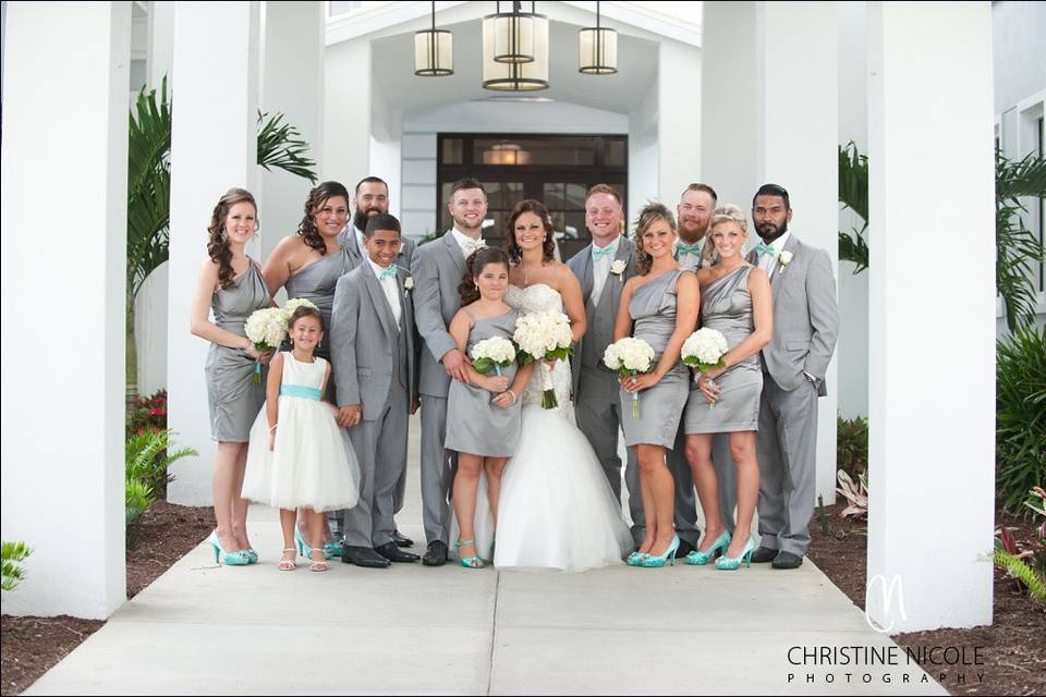 The couple with the bridesmaids and groomsmen