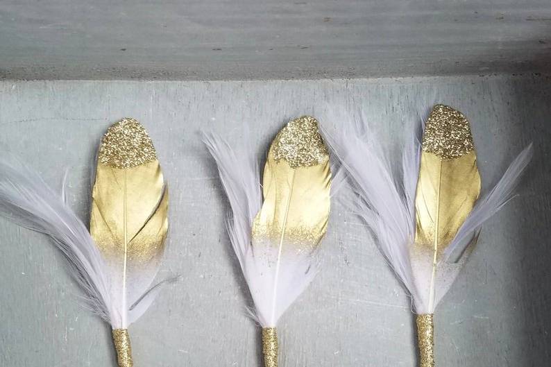 Gold feather boutonnieres
