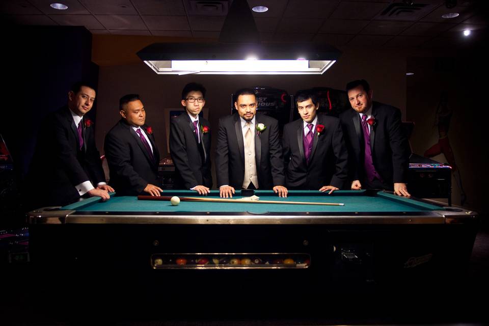 Gather the groomsmen in the arcade for a serious yet fun photo!