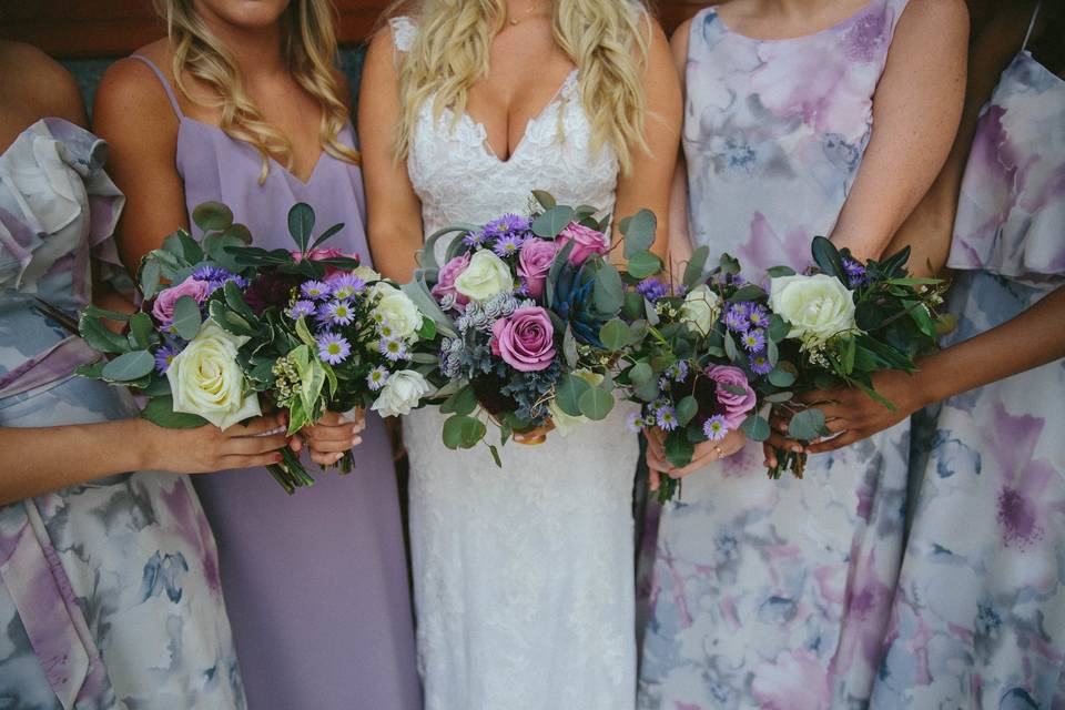 Dresses from Camille's of Wilmington. Flowers by The Petal & The Pearl Events. Lavender and sage with succulents. Photo by Lightbloom Photography.