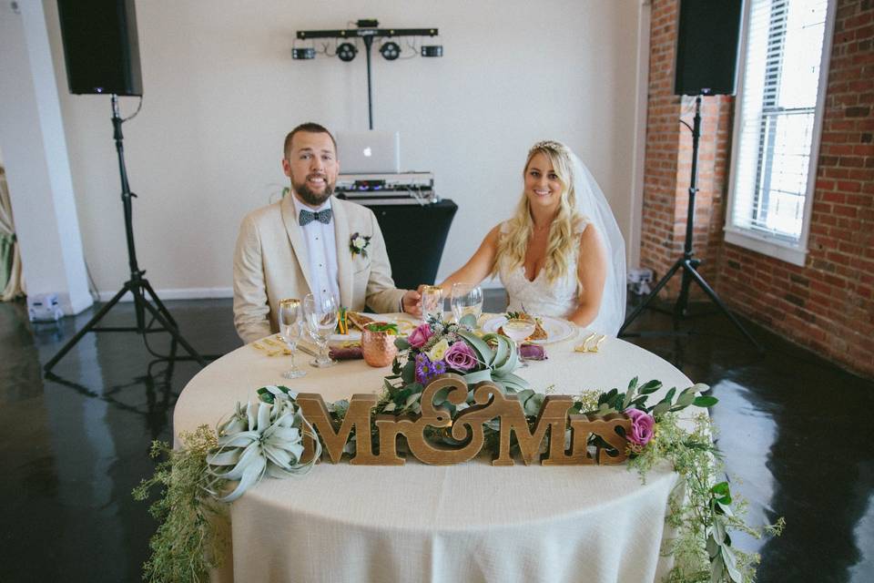 Sweetheart table in The River Room. Flowers by The Petal & The Pearl Events. Photo by Lightbloom Photography.