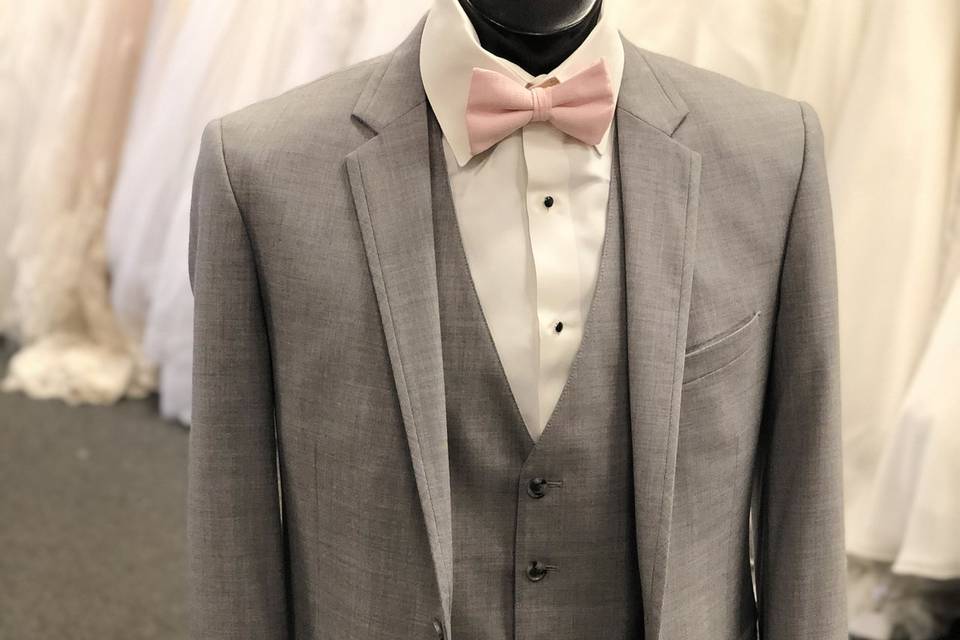 Suit with pink bow tie