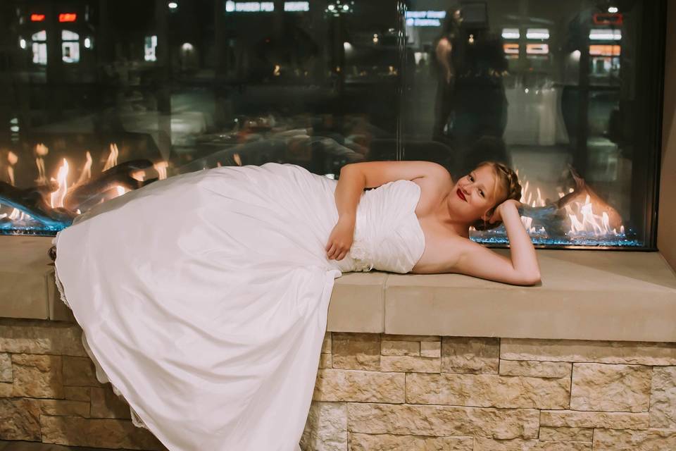 Lounging bride by the fire