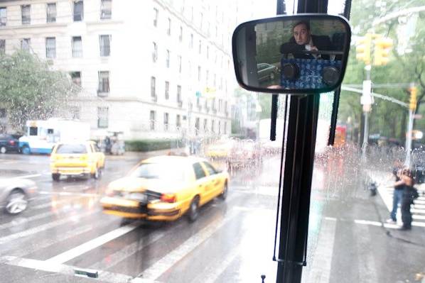 The groom nervously waits inside for a rainstorm to pass so we can start his outdoor ceremony in Central Park.