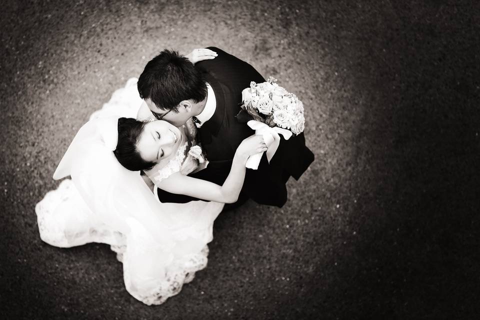 Wedding couple embrace photographed from above in Minneapolis, Minnesota.