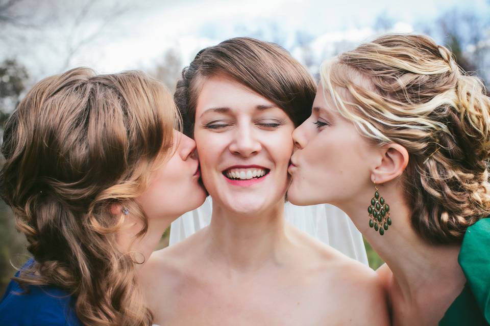 Bride with her sisters at her side in Valpraiso, Indiana wedding.