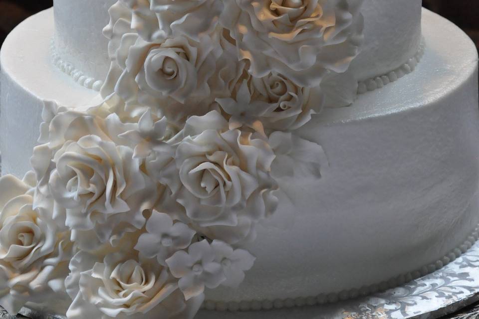 Classic White buttercream cake with handmade sugar paste roses!