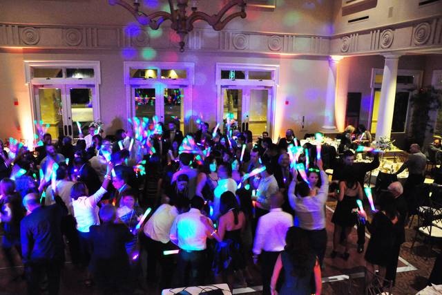 Couple dancing together with their guests