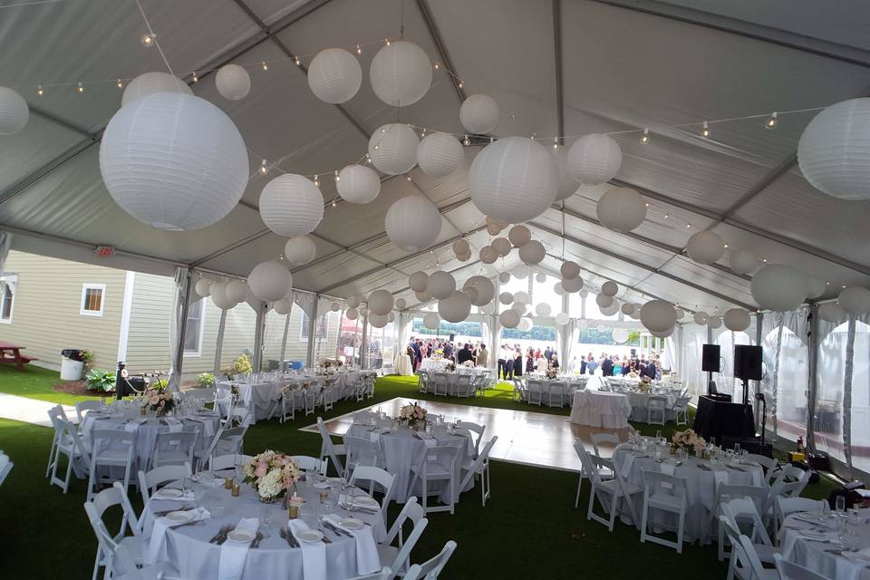 String lighting and white paper lanterns at the Lake House Guest Cottages of the Berkshires.