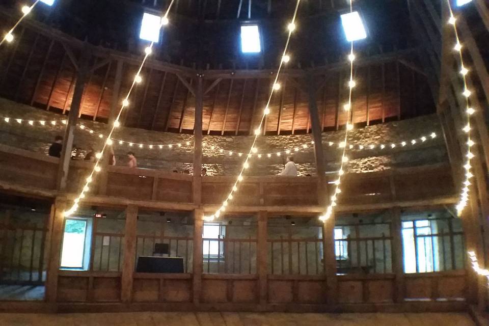 String lighting over the dance floor in the historic Round Stone Barn at Hancock Shaker Village.