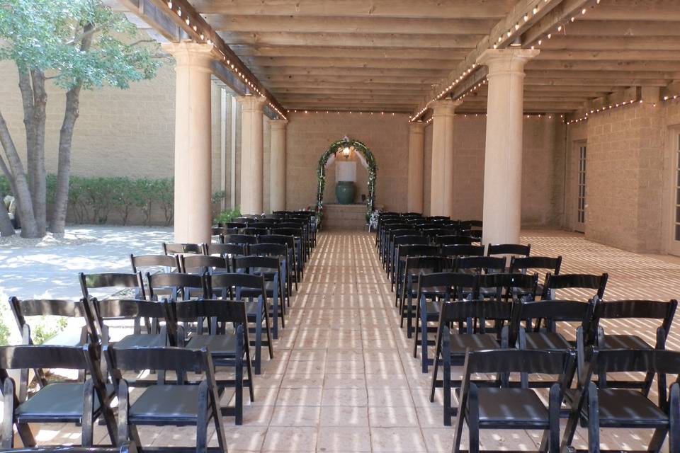 The East, large patio with pergola is a perfect location for your ceremony or reception.