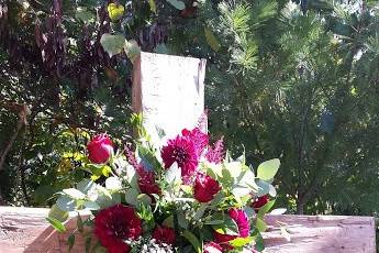 Wooden cross with fresh flower