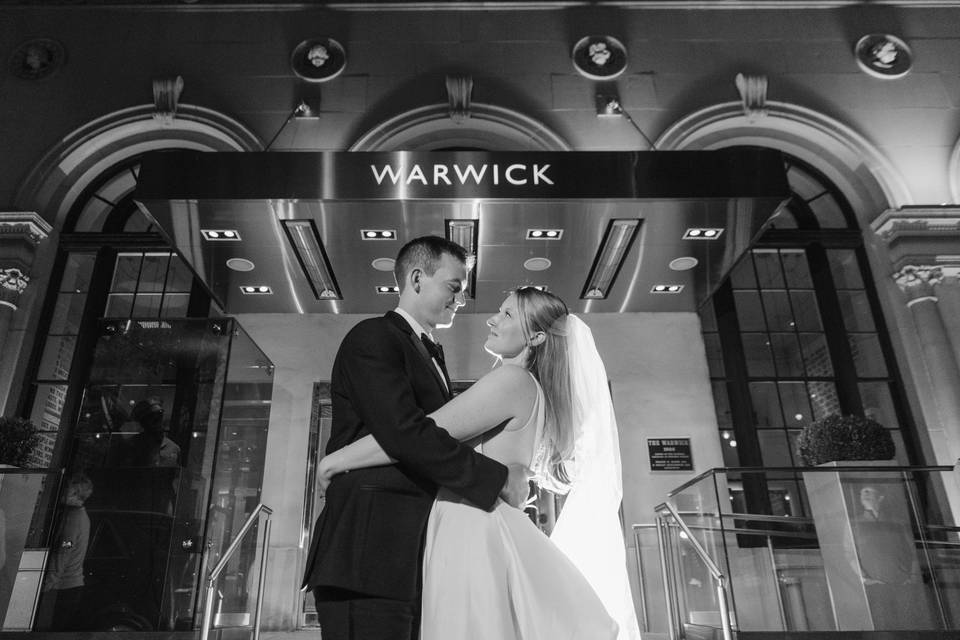 Couple under lobby sign