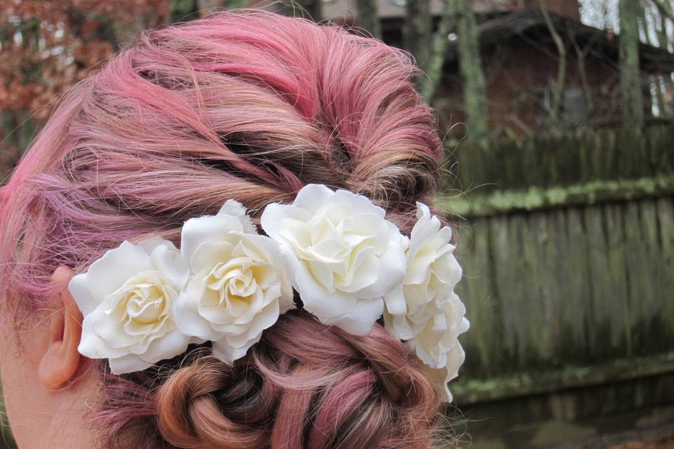 Pink updo with white flowers