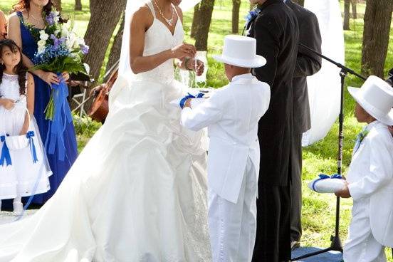 The bride takes the groom's ring.