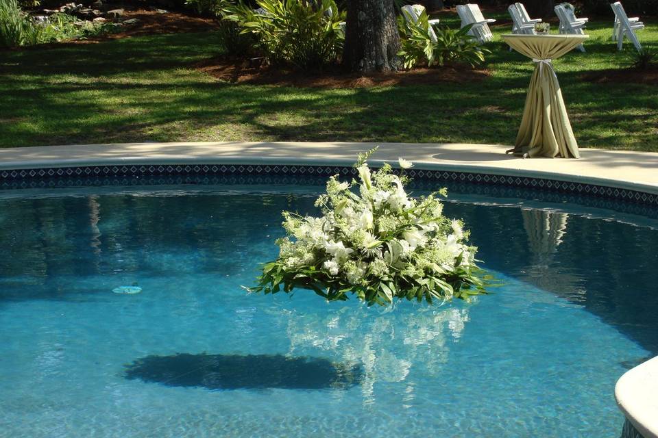 Pool float of all white flowers.