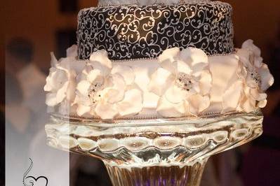 Black and white wedding cake with fun oversized floral by Tamara's the Cake Guru Wisconsin