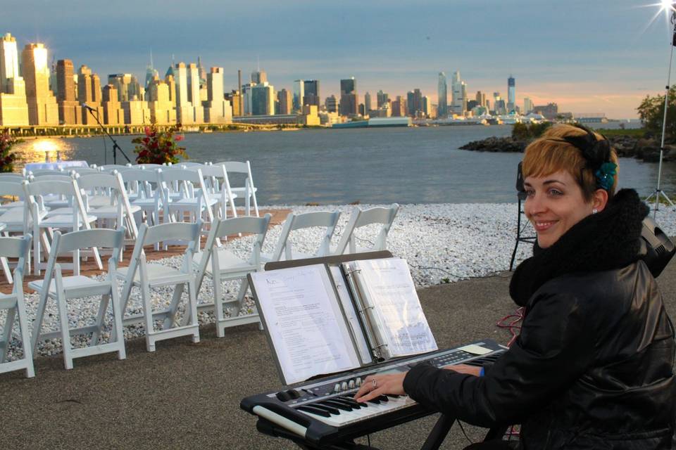 Outdoor ceremony at The Waterside Restaurant and Catering in North Bergen, NJ.  Absolutely beautiful view of Manhattan in the background!