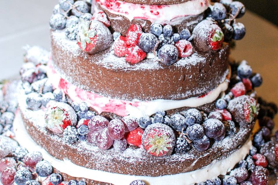 Chocolate Lovers Heirloom Pound Cake loaded with chocolate covered strawberries, blueberries, raspberries, grapes and blackberries