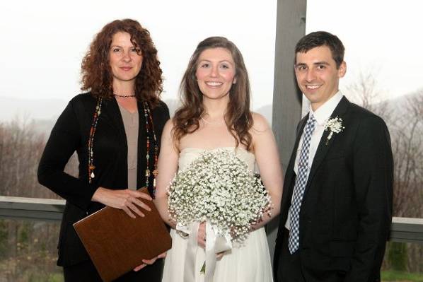 Newlyweds and officiant