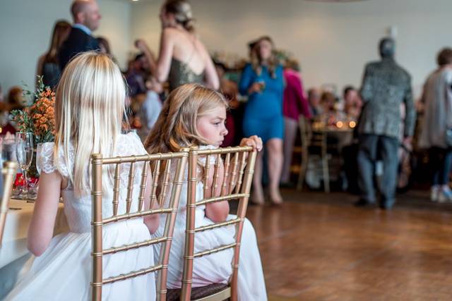 Flower girls watching the party go on!