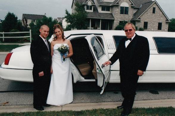Newlyweds entering the limo
