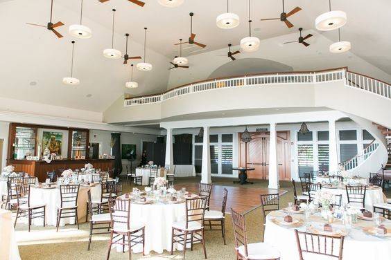 Indoor reception at Sugar Beach Pavilion, destination wedding, Chiavari Chairs, Ivory Linen, Romantic wedding theme, Pink and white flowers, round dining tables, 12x12 dance floor