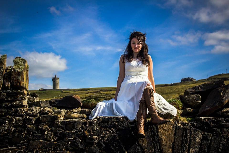 Doonagore Bay on the Wild Atlantic Way. This magical cliff edge location has bubbling streams and ancient stone bridges overlooked by the fairytale Doonagore Castle.