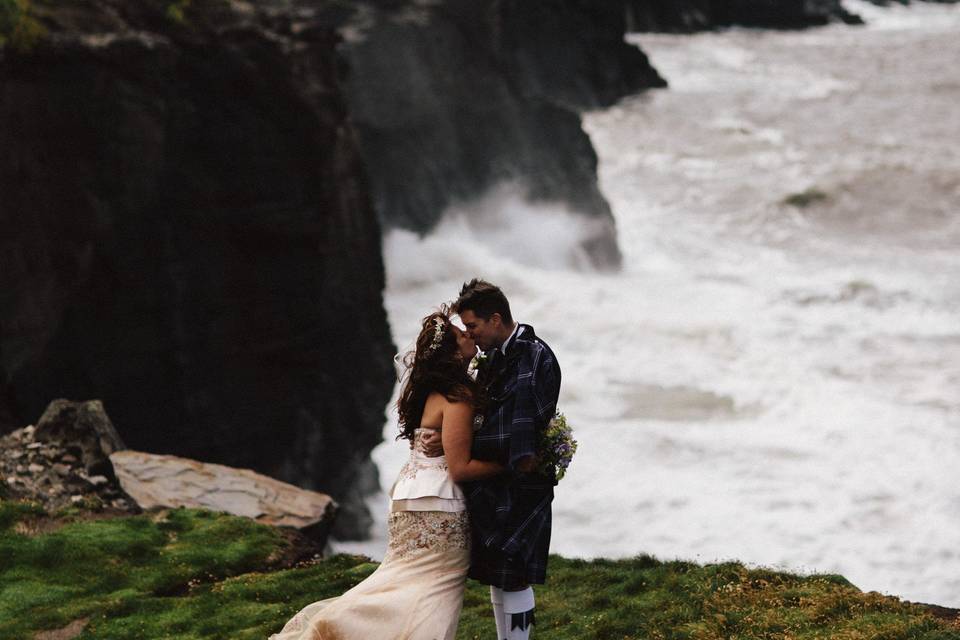 Doonagore Bay on the Wild Atlantic Way. This magical cliff edge location has bubbling streams and ancient stone bridges overlooked by the fairytale Doonagore Castle.