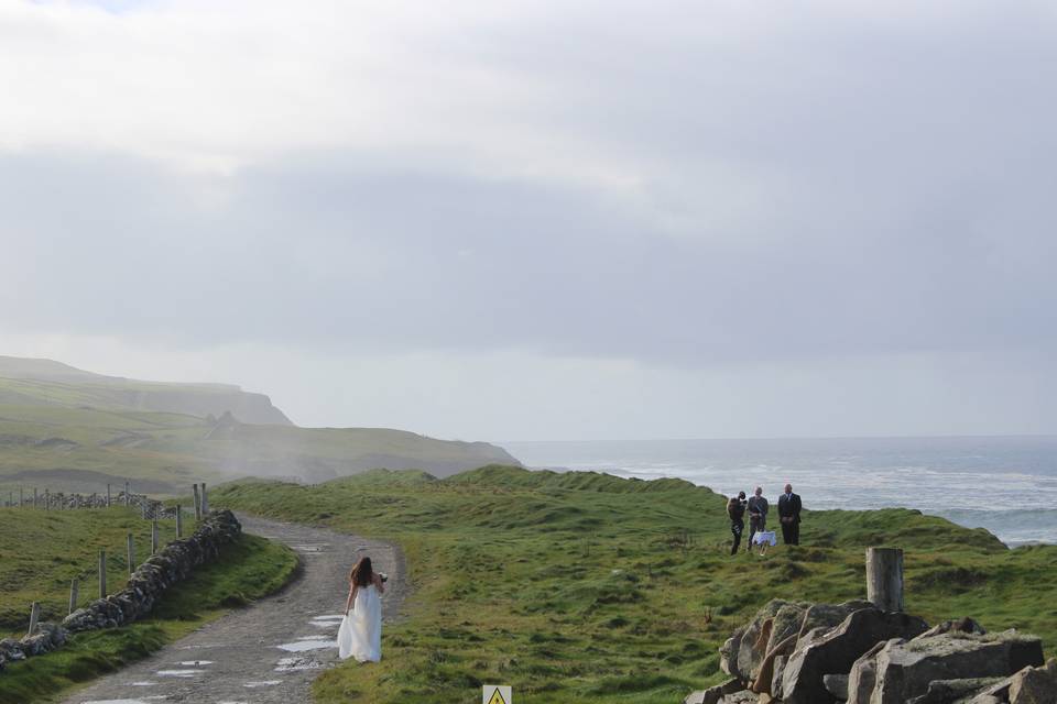 Hags Head is a  stunning remote edge of the world cliff top location. Towering 600 ft above the waves and featuring  dramatic cliffs views its a dreamy one of a kind wedding location.