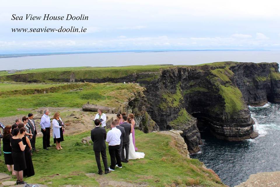 Hags Head is a  stunning remote edge of the world cliff top location. Towering 600 ft above the waves and featuring  dramatic cliffs views its a dreamy wedding location.