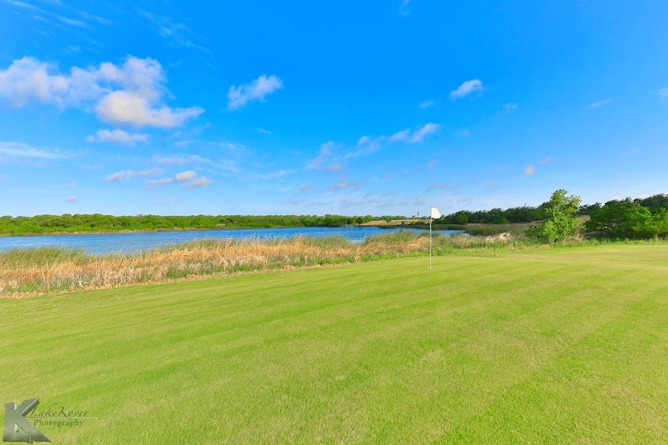 Golf green by the lake