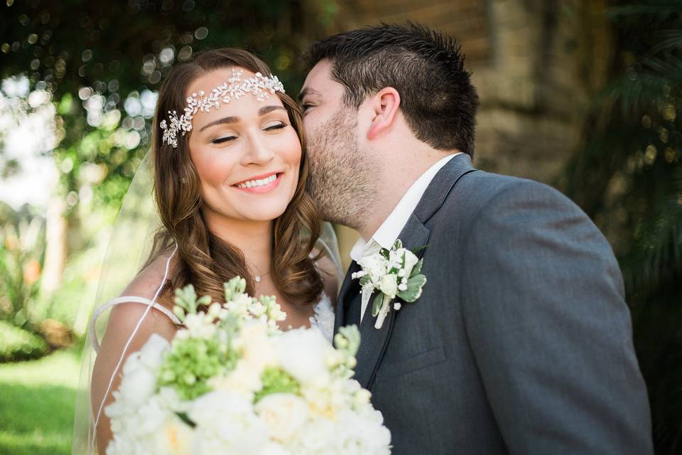 Groom kissing his bride