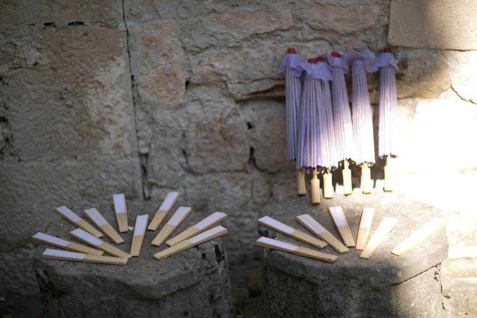 Fans and parasols for guests.