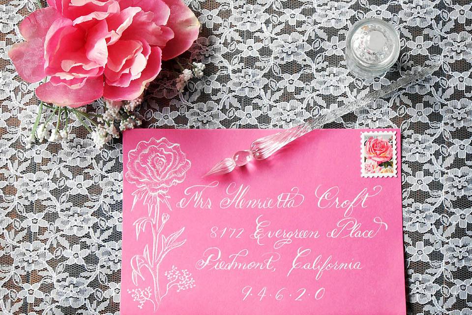 Calligraphy addressed Pink Envelope with Peony design using dip nib and White ink.
