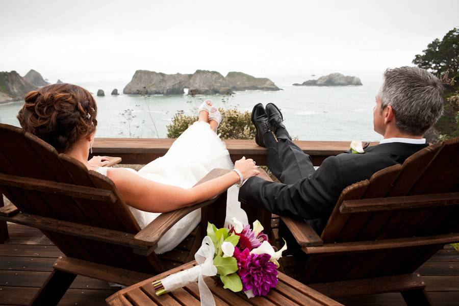 Bride and groom enjoying a quiet moment alone by the Pacific Ocean before heading to the reception at the Harbor House Inn, in Elk, California.