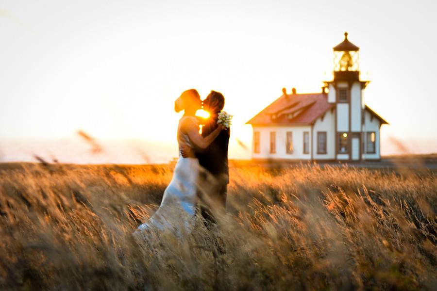 Sunset wedding at the historical Point Cabrillo Lighthouse, on the Mendocino Coast of Northern California.