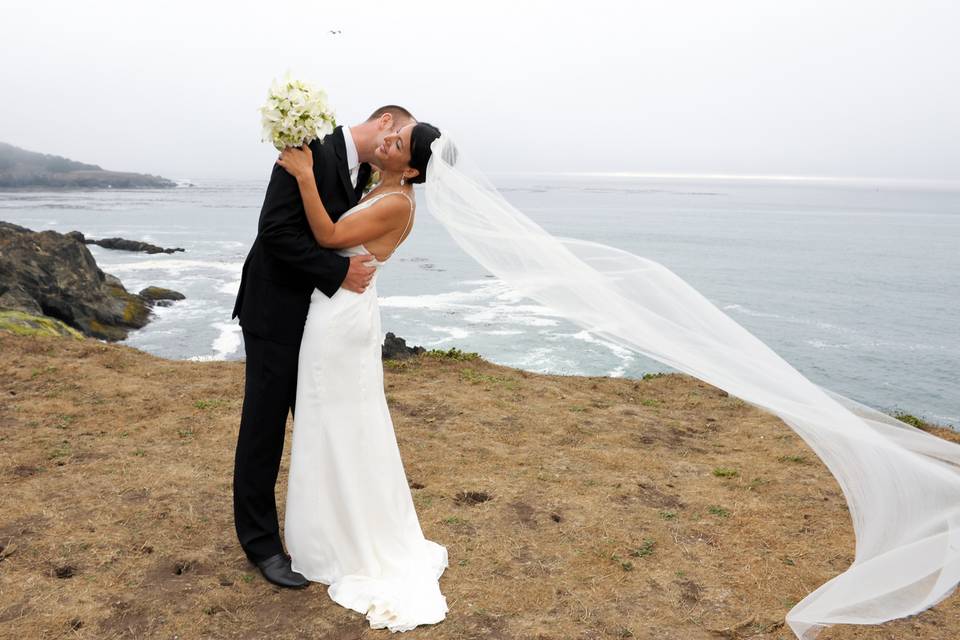 Elegant and romantic wedding celebration on the headlands overlooking the Pacific Ocean in Mendocino, California.