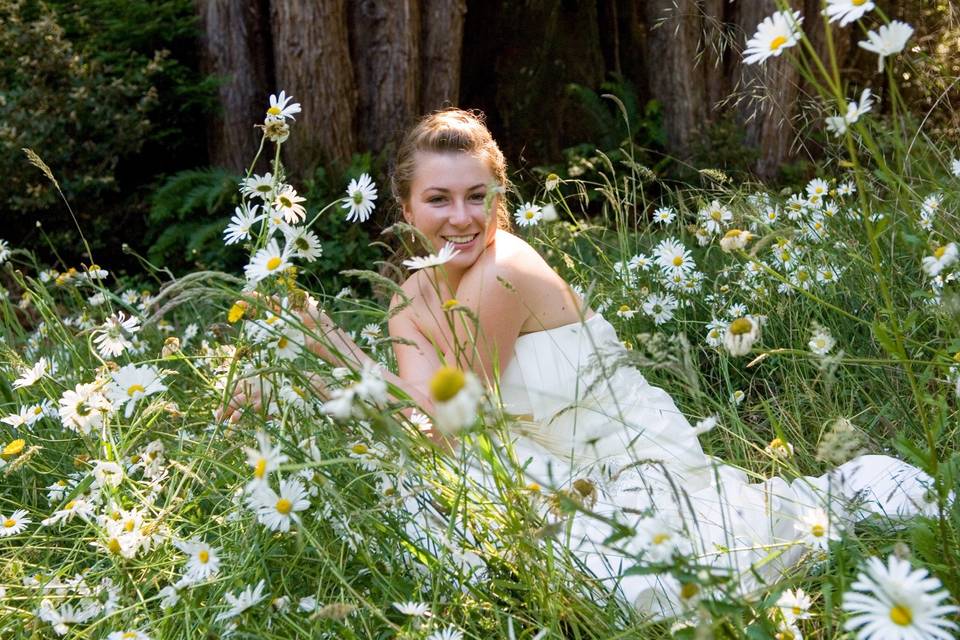 A quiet moment of reflection for this bride, after the ceremony and before the reception, at a casual wedding in the woods outside of Mendocino, California.