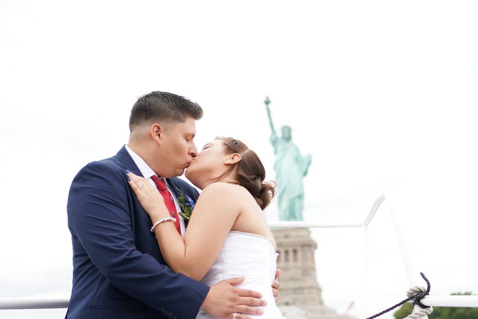 Wedding kiss aboard the Jacana by Empire Cruises