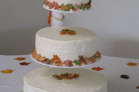 Cake recipe was a grooms grandmother recipe, Chocolate Dot Pumpkin cake with cream cheese frosting and surrounded by fall colored fondant leaves