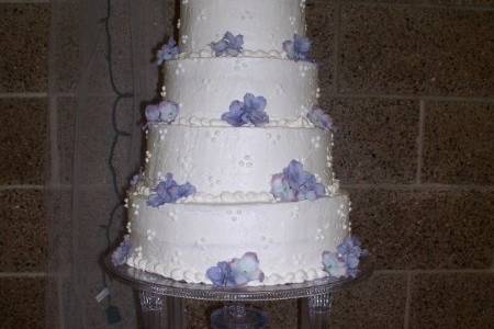 Each layer a different flavor and fillings, waterfall colored to match silk flowers on cake