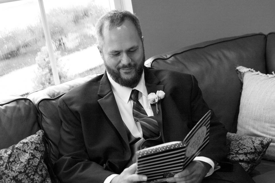 Groom reading letter