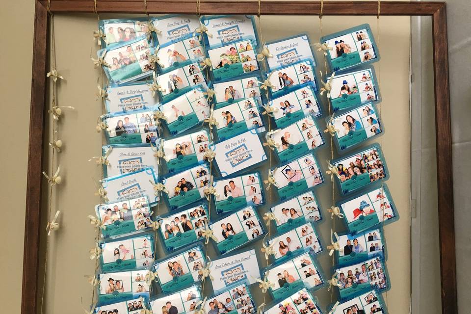 Great idea! Duplicate copies of the Photo Booth photos were clipped on clotheslines attached to a large frame. Couples knew where to clip it on because each guests' names were printed.